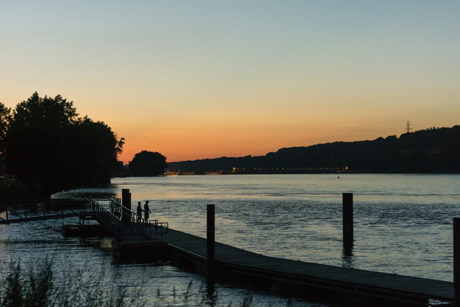 A timber jetty on the river at dusk