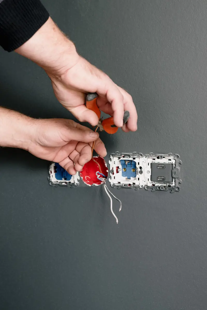 Electrician wiring a new double power point