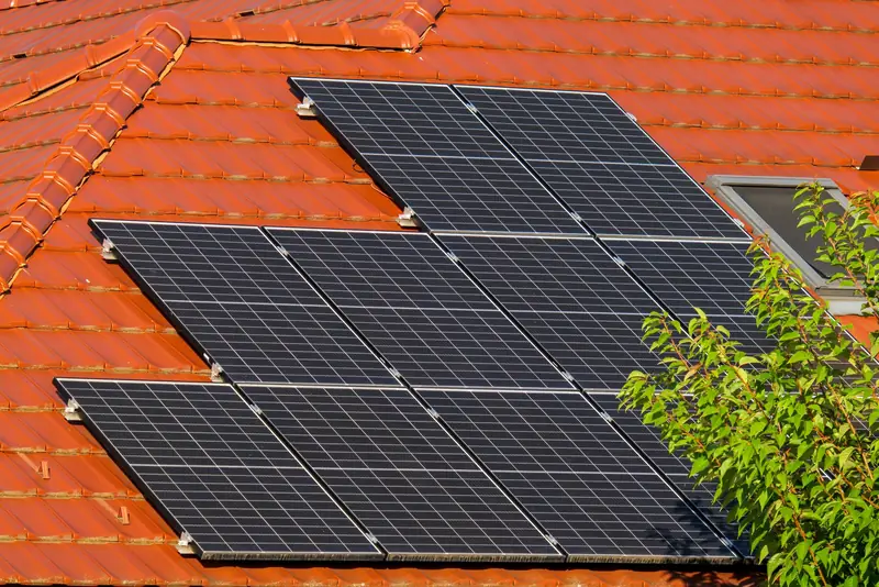 Solar panels on a terracotta tiled roof